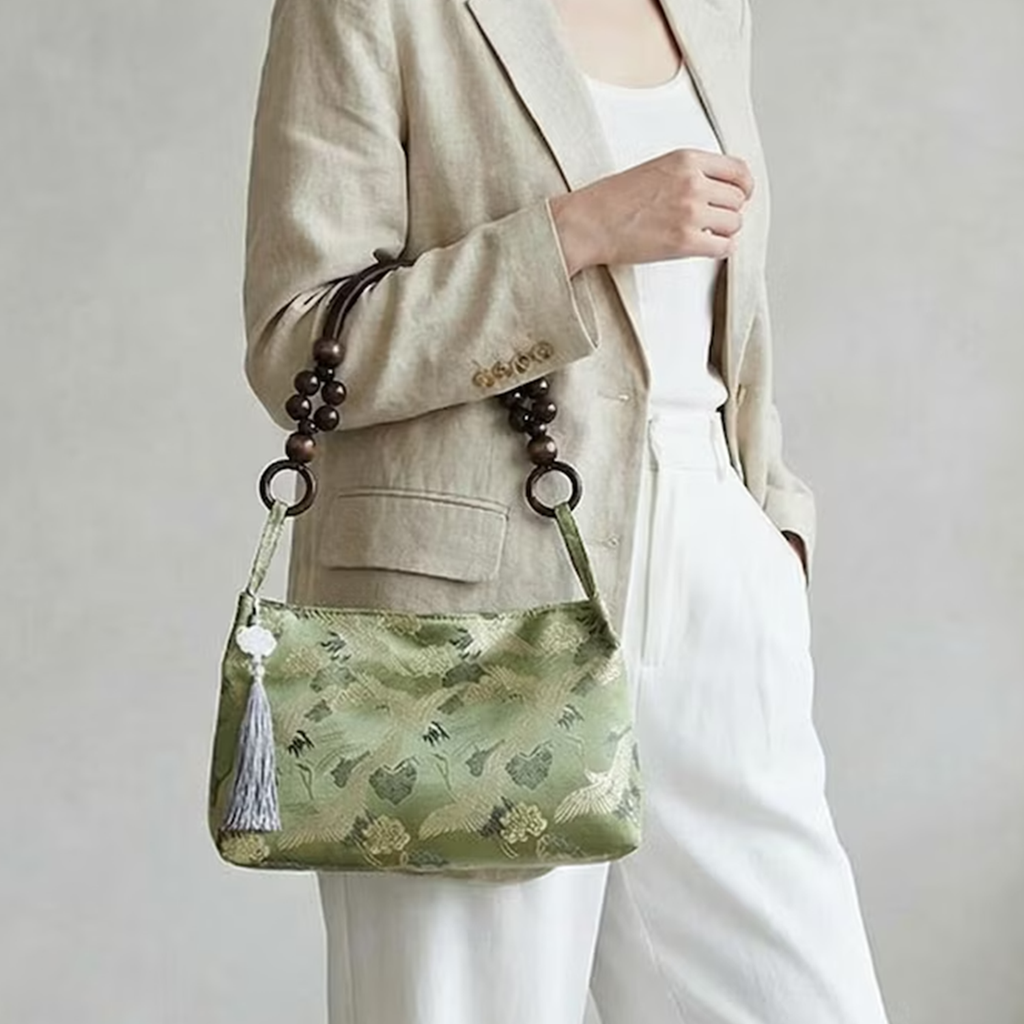 Multi-Tone Crane Embossed Curved Hobo Pouch With Wooden Bead Carry Frame, Jade Accent Tassel And Inner Zipper Divided Pocket